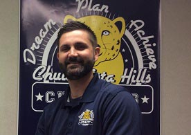 Principal smiling at camera